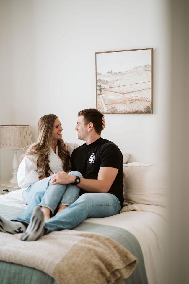 Couple sitting together at home during the Genesis Midwifery session.