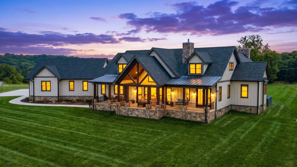 Custom home exterior with illuminated windows at twilight