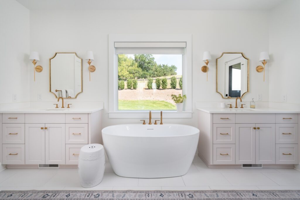 Bright bathroom with freestanding tub and double vanity